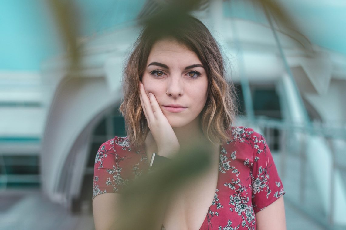 woman resting head on right hand