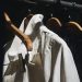 white dress shirt hanged on brown wooden clothes hanger