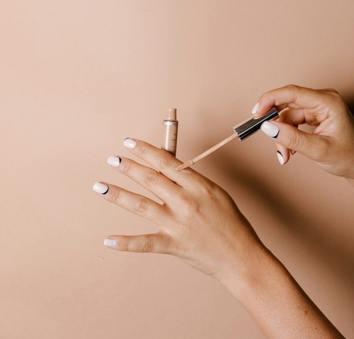 person holding white cigarette stick