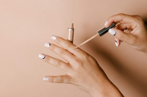 person holding white cigarette stick