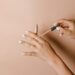 person holding white cigarette stick