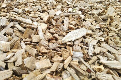 a pile of wood chips sitting on top of a wooden floor
